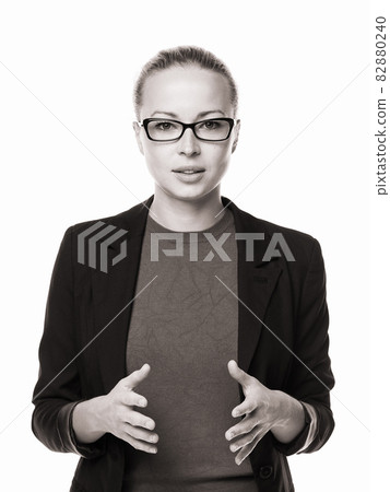 Business woman standing with arms crossed against white background.. 82880240