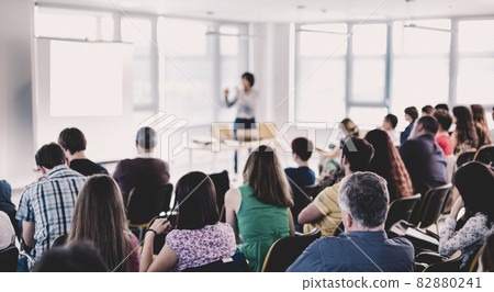 Businessman making presentation on corporate meeting event. Businessman making presentation on corporate meeting event. 82880241