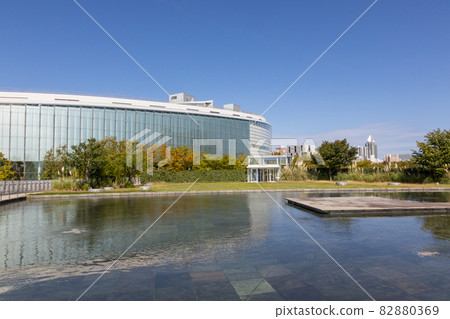 Niigata City Performing Arts Center seen from the aerial garden of Hakusan Park 82880369