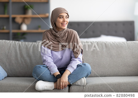 Muslim woman having rest at home on the weekend Muslim woman having rest at home on the weekend 82880498