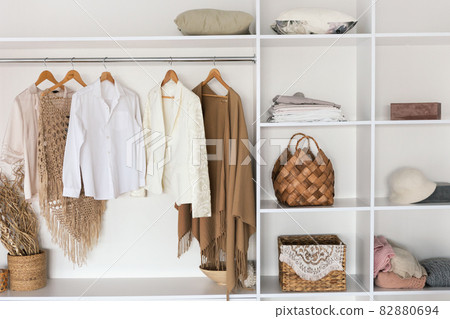 Interior Of Spacious Wardrobe Room Full Of Female Clothes Indoor 82880694