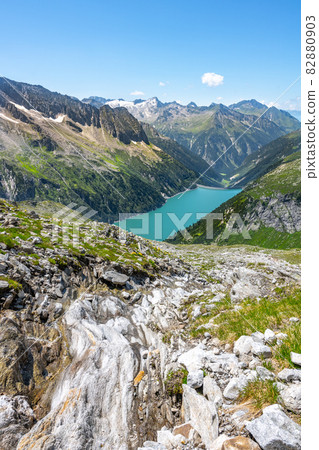Beautiful alpine walley with azure blue water of Speicher Zillergrundl dam, Zillertal Alps, Austria 82880903