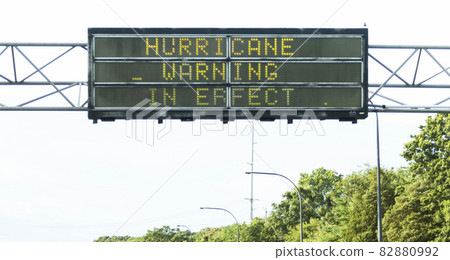 Hurricane warning sign above a highway on Long Island Hurricane warning sign above a highway on Long Island 82880992