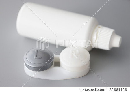 Storage container for soft contact lenses and solution bottle on table Storage container for soft contact lenses and solution bottle on table 82881138