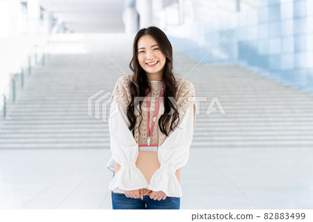 Young female engineer standing in the office lobby Young female engineer standing in the office lobby 82883499