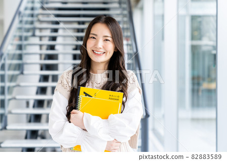 Young female college student on campus Young female college student on campus 82883589