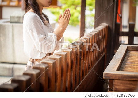 A woman who visits a shrine, a woman who wishes at a shrine, a person who wishes A woman who visits a shrine, a woman who wishes at a shrine, a person who wishes 82883760