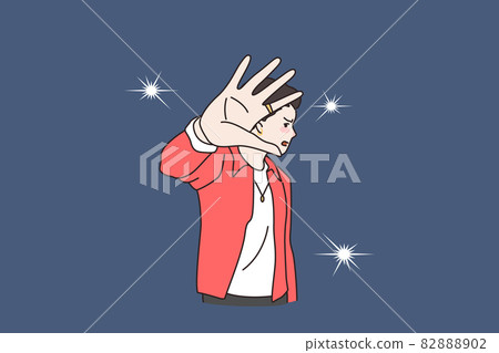Unhappy man celebrity annoyed by photographer camera flashes 82888902