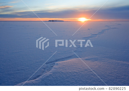 Sunrise over a frozen bay. Sunrise over a frozen bay. 82890225
