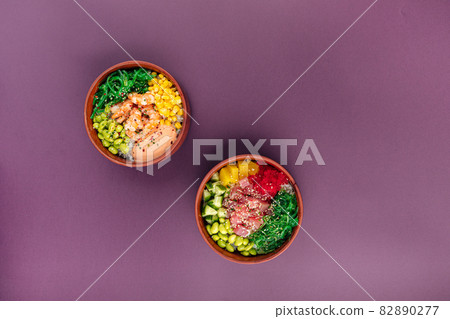 Two hawaiian poke bowls with tuna fish and shrimp 82890277