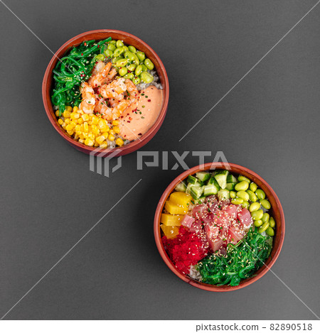 Two hawaiian poke bowls with tuna fish and shrimp 82890518
