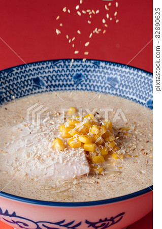 Bowl of cheese ramen noodle soup with corn Bowl of cheese ramen noodle soup with corn 82890625