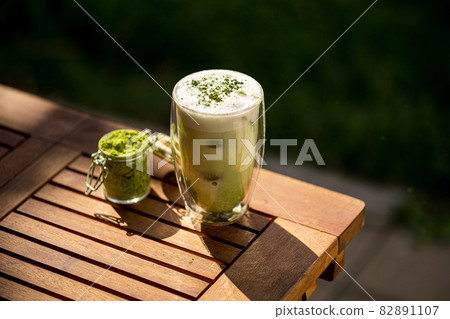 Matcha green tea with ice cubes Matcha green tea with ice cubes 82891107
