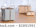 Christmas gifts in craft style on background of bokeh of lights 82891991