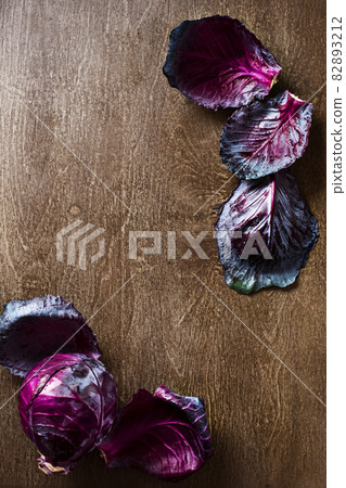 leaf red cabbage slate and wooden counter top background leaf red cabbage slate and wooden counter top background 82893212