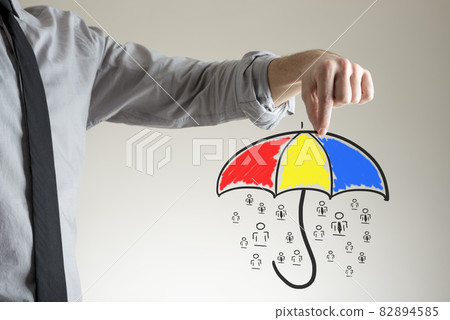 Holding umbrella over people concept 82894585