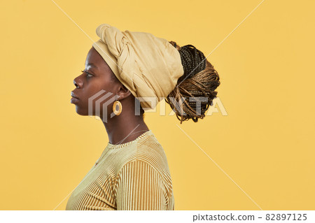 Ethnic African American Woman on Yellow Profile View Ethnic African American Woman on Yellow Profile View 82897125