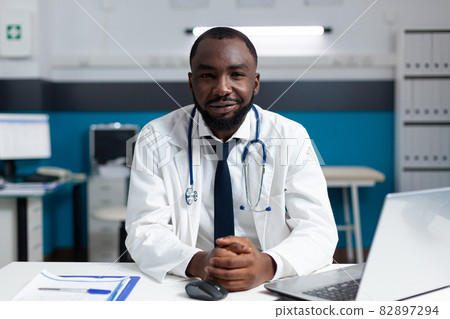 Portrait of african american practitioner doctor working in hospital office Portrait of african american practitioner doctor working in hospital office 82897294