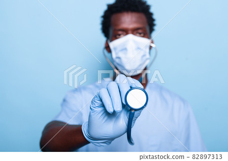 Close up of cardiologist with stethoscope for heartbeat examination 82897313