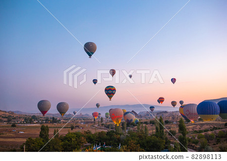 Bright hot air balloons in sky of Cappadocia, Turkey 82898113