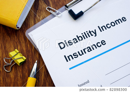 Disability Income DI Insurance application form and pen. Disability Income DI Insurance application form and pen. 82898300