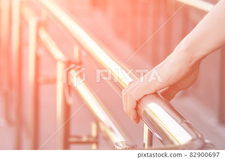 Hand using handrail for wheelchair. Man support 82900697