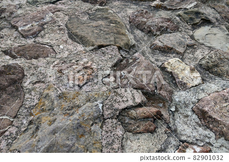 Close-up of the stone texture of the rock in the mountains, background. 82901032