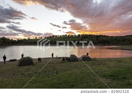 Fishing adventures. Carp fishing at sunset. 82902328