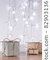 Christmas gifts in craft style on background of bokeh of lights 82903136