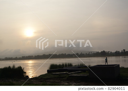 Bodh Gaya, India People looking at the Falgu River Bodh Gaya, India People looking at the Falgu River 82904011