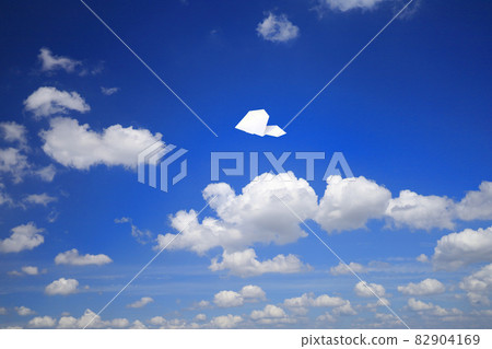 Paper plane flying in the sky 82904169