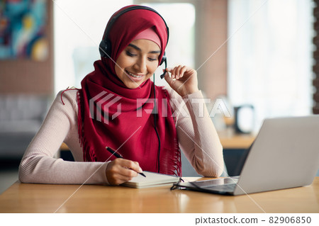 Middle-eastern young lady student attending online webinar Middle-eastern young lady student attending online webinar 82906850