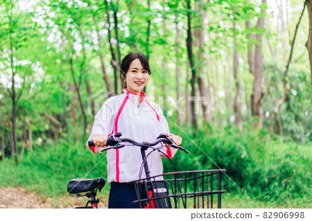 Young woman enjoying cycling in nature Young woman enjoying cycling in nature 82906998