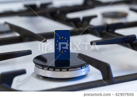 Shortage and gas crisis. Flag of the European Union on the switched off gas stove 82907608