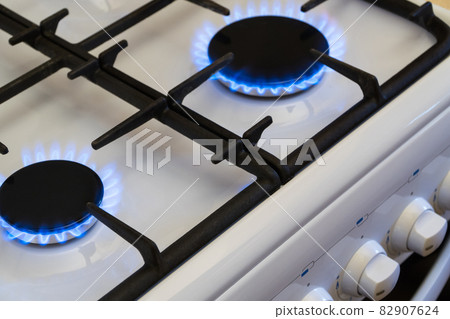 Gas burning in the burner of gas stove, gas shortage and crisis, top view Gas burning in the burner of gas stove, gas shortage and crisis, top view 82907624