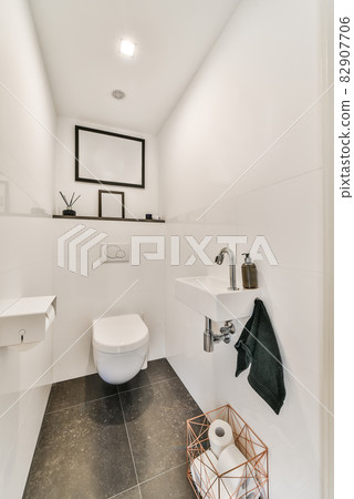Interior of small clean toilet in miniature style 82907706