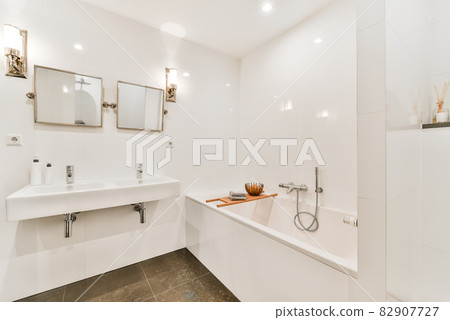 Bright elegant bathroom interior in a luxury house Bright elegant bathroom interior in a luxury house 82907727