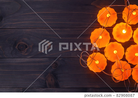 Halloween background, Pumpkin String Lights On Wooden Table Halloween background, Pumpkin String Lights On Wooden Table 82908087