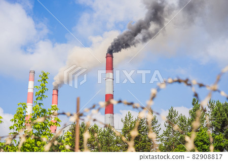 plant pipe with smoke against blue sky plant pipe with smoke against blue sky 82908817