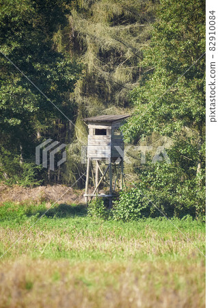 Deer hunting tower by a forest, selective focus. 82910084