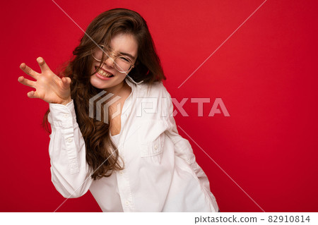 Portrait of young emotional positive sexy beautiful brunette woman with sincere emotions wearing Portrait of young emotional positive sexy beautiful brunette woman with sincere emotions wearing 82910814