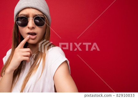 Closeup of young emotional funny thoughtful beautiful attractive cute dark blonde woman with sincere 82910833