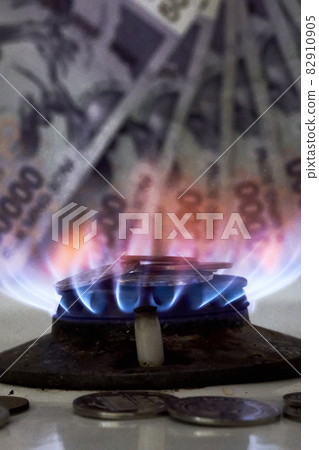 Burning gas stove burner and Uzbek money - sum banknotes. Pay for natural gas, bill, tariff. Growing tariffs for gas. Pile of coins and burning fire gas stove hob and money Burning gas stove burner and Uzbek money - sum banknotes. Pay for natural gas, bill, tariff. Growing tariffs for gas. Pile of coins and burning fire gas stove hob and money 82910905