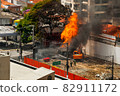 Firefighters fighting a fire in a brazilian street 82911172