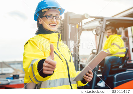 Workers in the logistics industry having a success 82911437