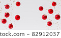 Christmas or New Year holidays background, red baubles with confetti, 3d render 82912037
