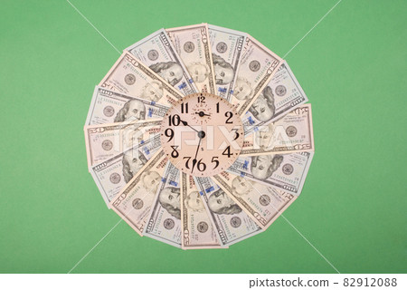 Concept of clock and dollar. Clock on mandala kaleidoscope from money. Abstract money background raster pattern repeat mandala circle. Concept of clock and dollar. Clock on mandala kaleidoscope from money. Abstract money background raster pattern repeat mandala circle. 82912088