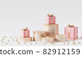 Golden podiums or pedestals for products or advertising with gift boxes, 3d render 82912159