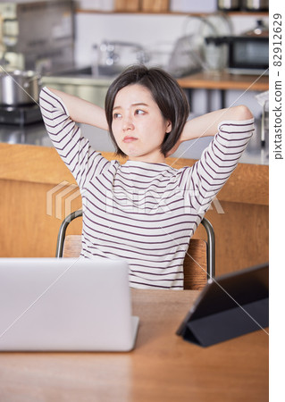 Telework (remote) tired young woman Telework (remote) tired young woman 82912629