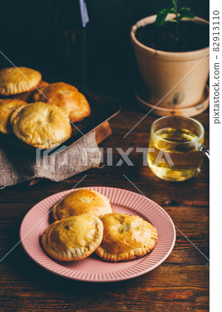 Hand Pies with Chives and Mushrooms Hand Pies with Chives and Mushrooms 82913110